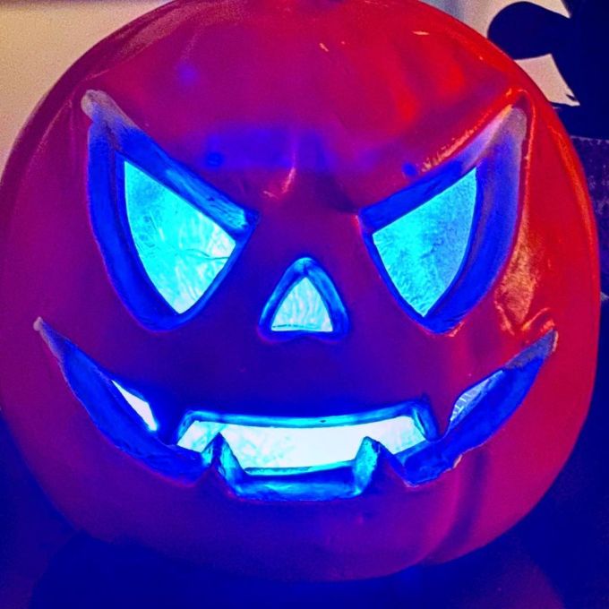 Jack-O-Lantern / Pumpkin head illuminated with blue lights