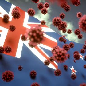 Coronavirus viruses in front of a New Zealand flag