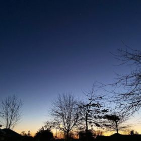 The sun's first rays are illuminating the skyline in Christchurch, New Zealand in winter on 3 July 2020