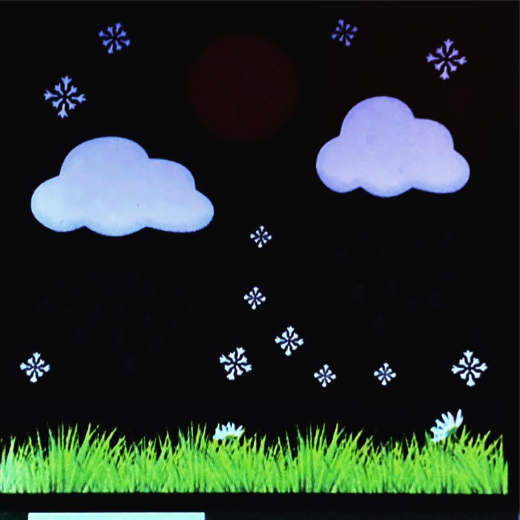 Home weather station screen showing clouds and snow flakes on the display, indicating snow is the upcoming weather system