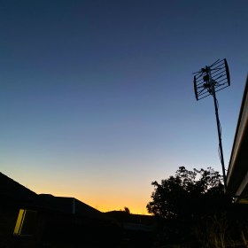 Winter sun setting low on the skyline in Christchurch, New Zealand on 22 July 2020