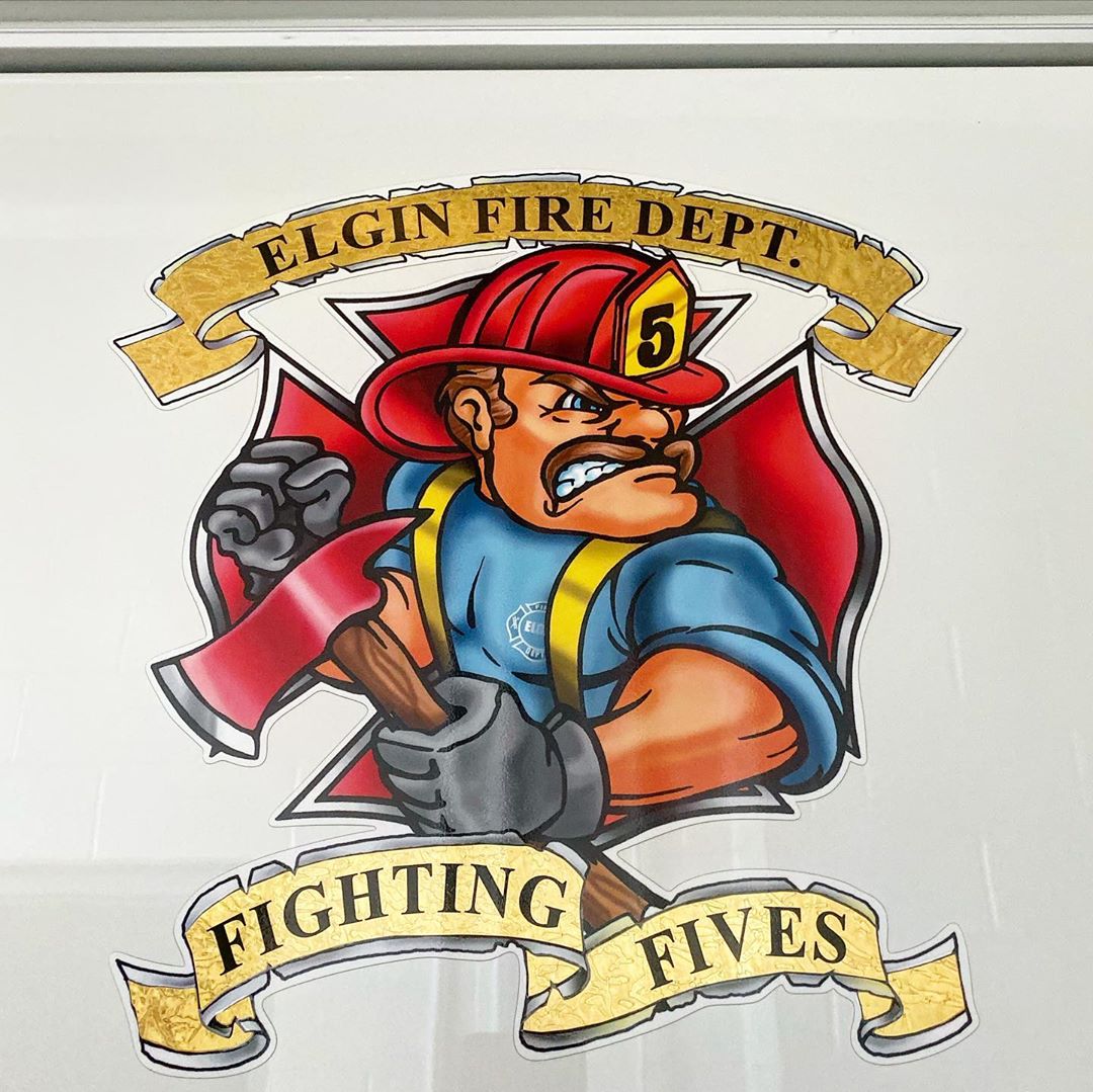 Mascot of the Elgin Fire Department Number 5 station: Firefighter with a helmet on and axe in hand with "Fighting Fives" below it